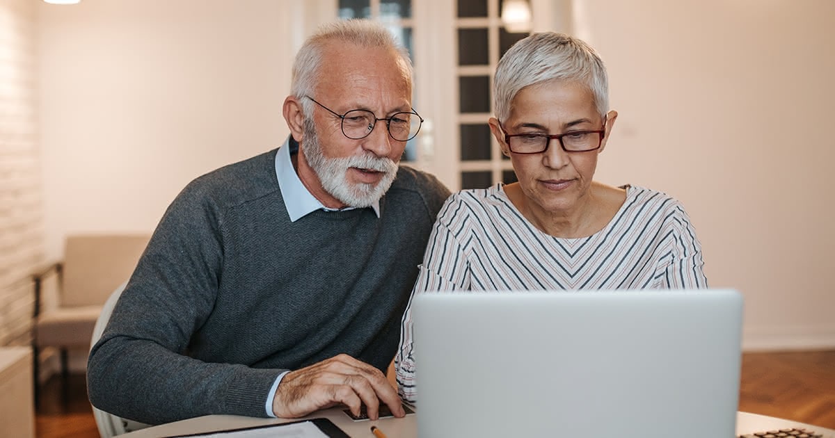 A couple looking at computer together